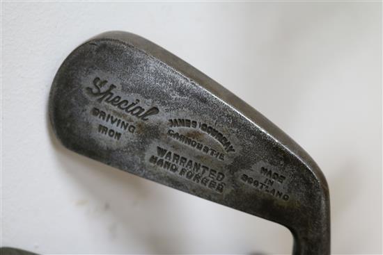 Two wooden drivers by Armstrong & Co and Paxton, a gun metal putto signed Jacques, 7 other and a golf ball